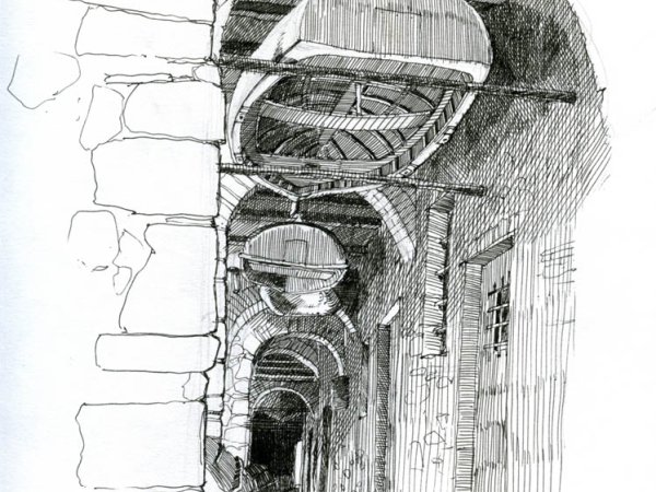 Covered Tellaro boat alleyway | Boats stored upside down in a fishing village in Liguria